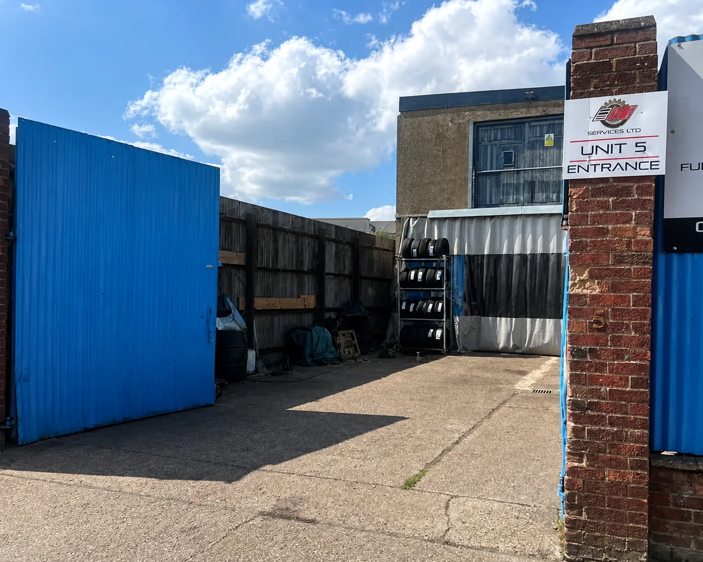 Blue entrance gate to AB Auto Services at Unit 5 on Unity Street